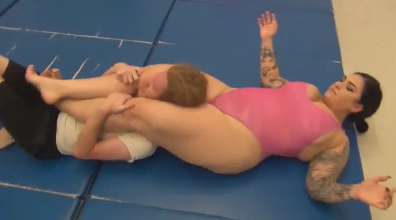 big woman wrestles him hard