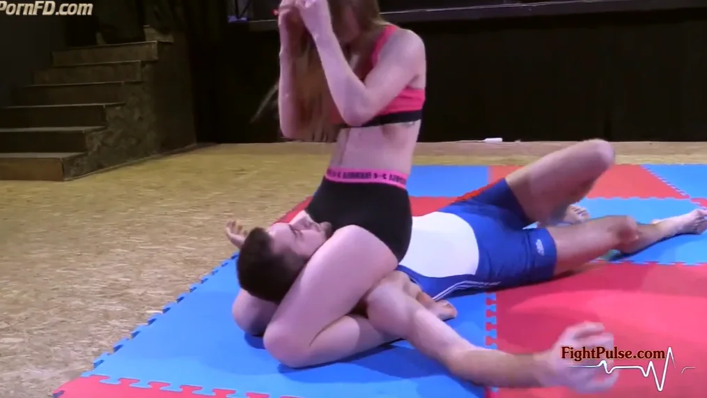 fitness woman wrestling versus tall guy