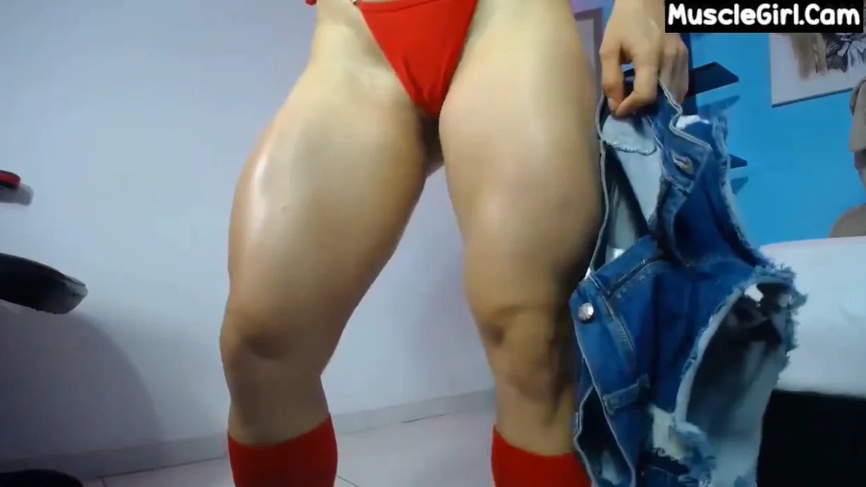 sexy fitness girl with muscle flexing strong legs