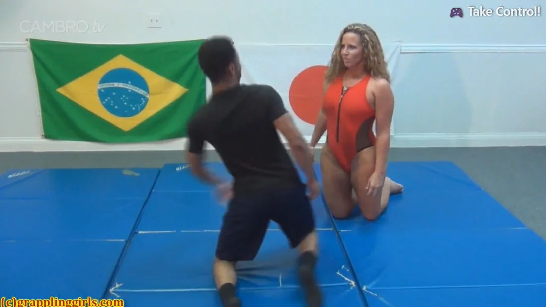 big blonde woman taps out man wrestling