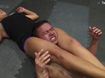 mikaela puts front headscissor on asian guy